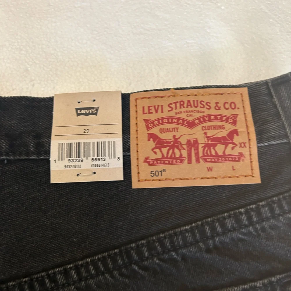 Levi’s NWT black 501 original fit high rise distressed black denim jean shorts